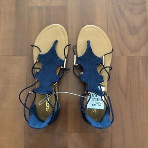 "Soda" brand. Denim and gold accent sandals